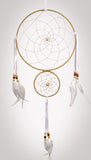 Large 8" diameter ring and smaller 4" ring wrapped in tan leather and adorned with white satin and feathers accented with brick red and beige wooden beads on white background.