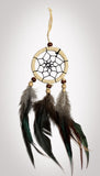 2-1/2" diameter ring wrapped in authentic creme leather with cream leather straps and brown & white feathers and brown and beige wooden beads on a white background.